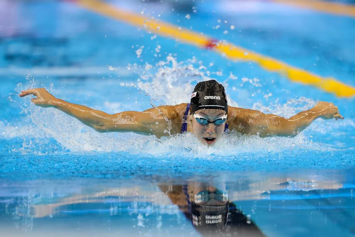 世界纪录保持者格蕾琴以破大会纪录的成绩赢得女子100米蝶泳金牌。（关俊威摄）