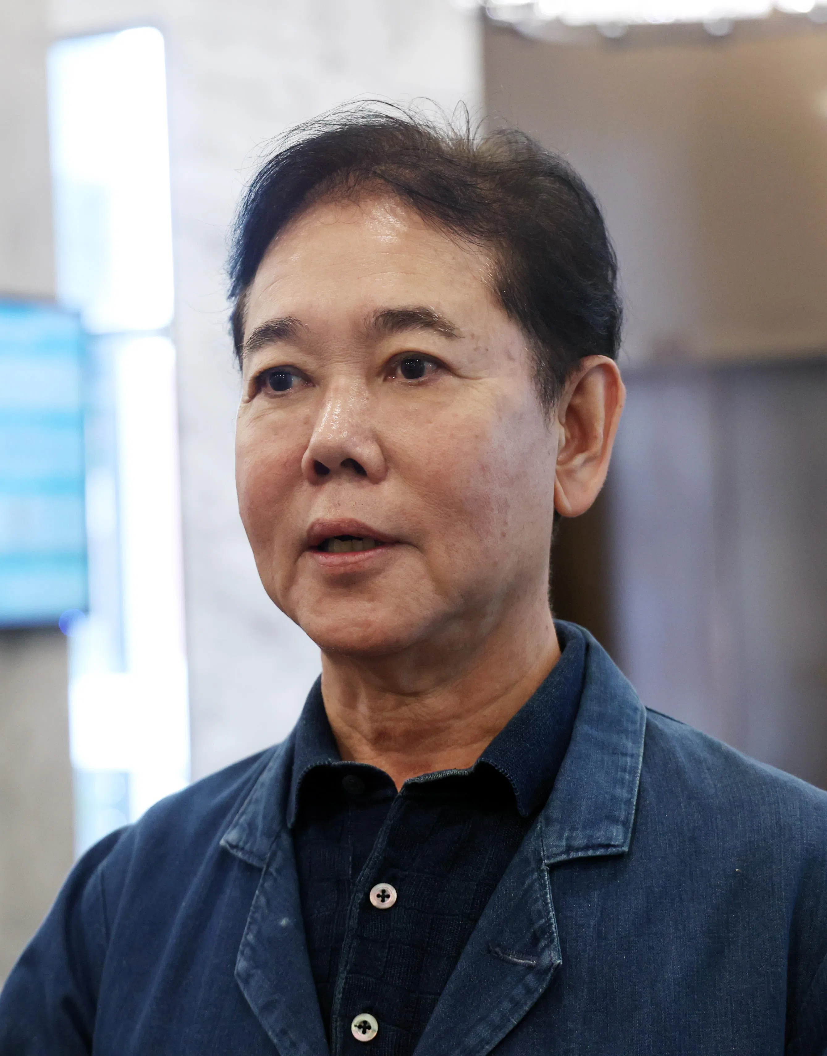 面包物语集团创办人郭明忠说，黄祖耀掌管家族企业，以及对孩子的管教，让每个孩子都各有所长，成为企业界精英，这一点让他感到钦佩万分。（邝启聪摄）