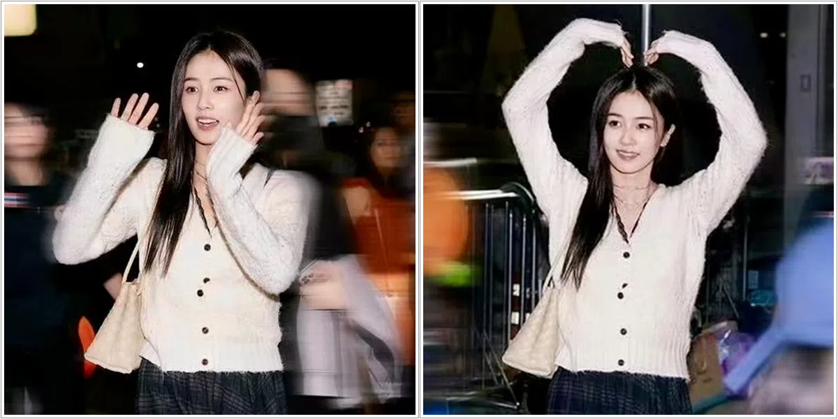 白鹿在保安的开路下步出机场，在上车前不忘放慢脚步跟当地粉丝挥手、比心，还不时双手合十以表谢意。（取自微博）