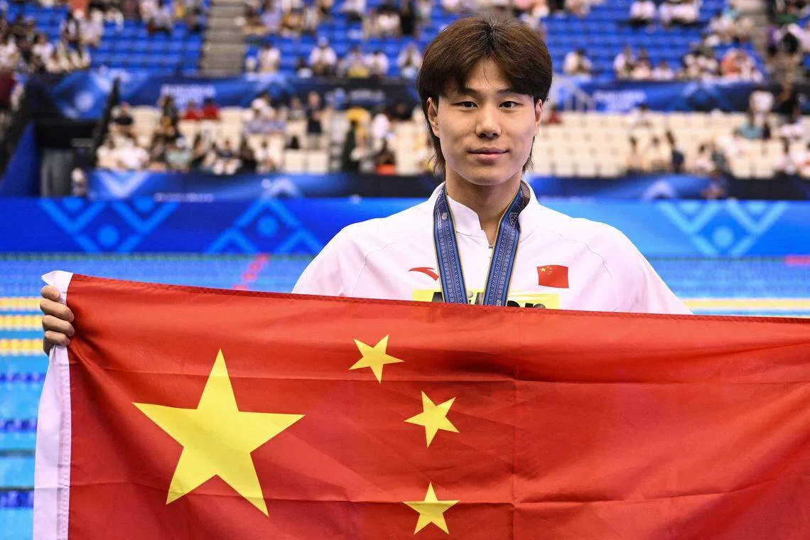 中国蛙王覃海洋在两个月前的世锦赛实现蛙泳金牌套餐，连续获得50米、100米和200米金牌。（法新社）