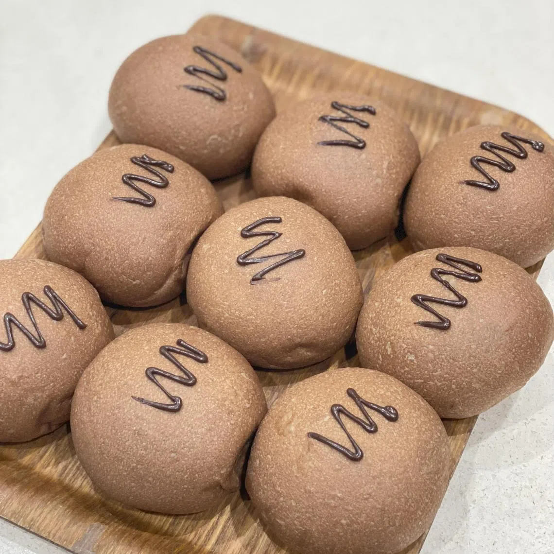 “真食”的小圆面包系列，包括巧克力榛子口味。（餐馆提供）