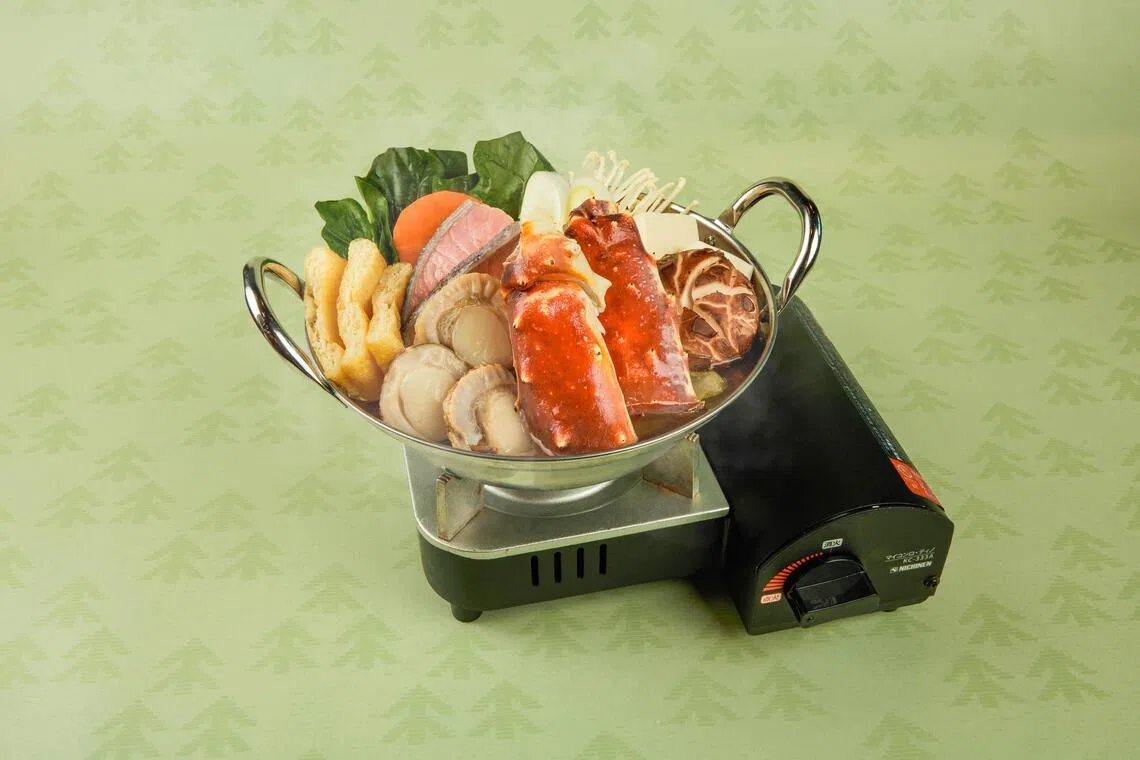 帝王蟹、青森扇贝火锅，口味清爽鲜甜。（餐馆提供）