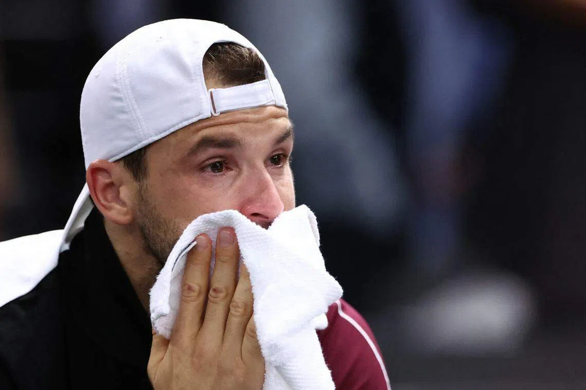 在决赛中落败的迪米特洛夫赛后落泪。（路透社）