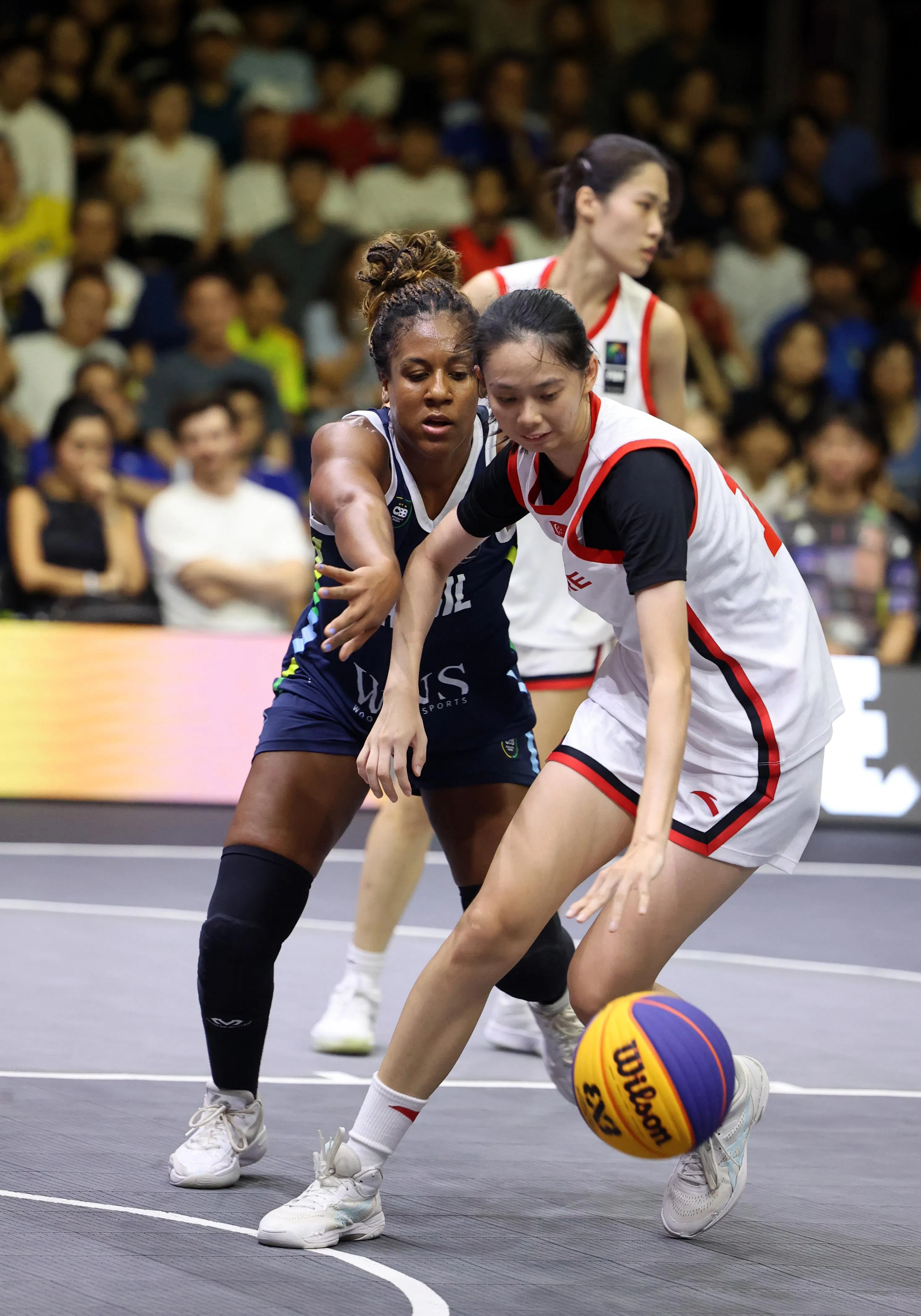 韩星悦（右）攻入绝杀球，帮助我国最终以15比13获胜。（邝启聪摄）