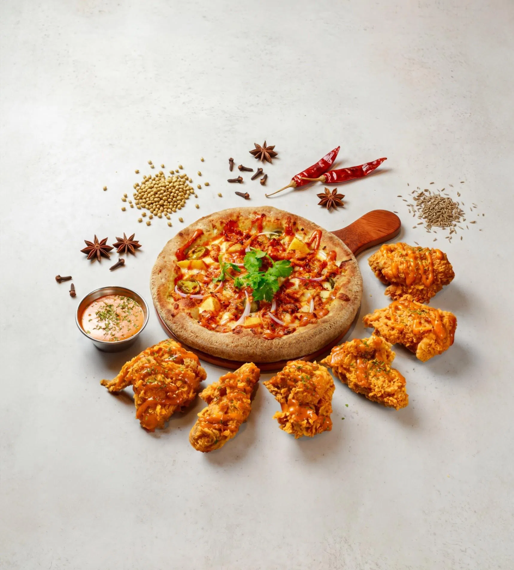 Pizza Maru的牛油鸡披萨，以鸡肉搭配浓郁牛油鸡酱汁。（品牌提供）