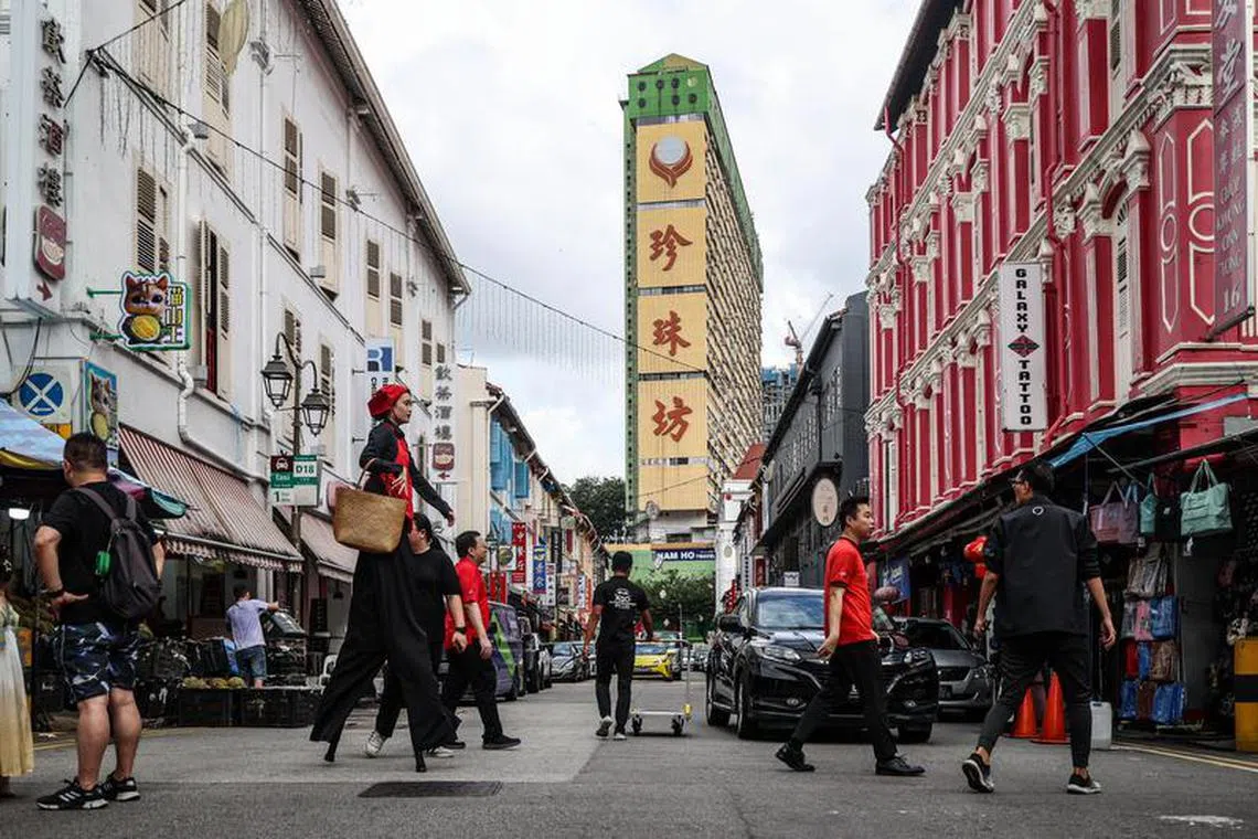 图为新加坡早期华族移民的聚集地牛车水。