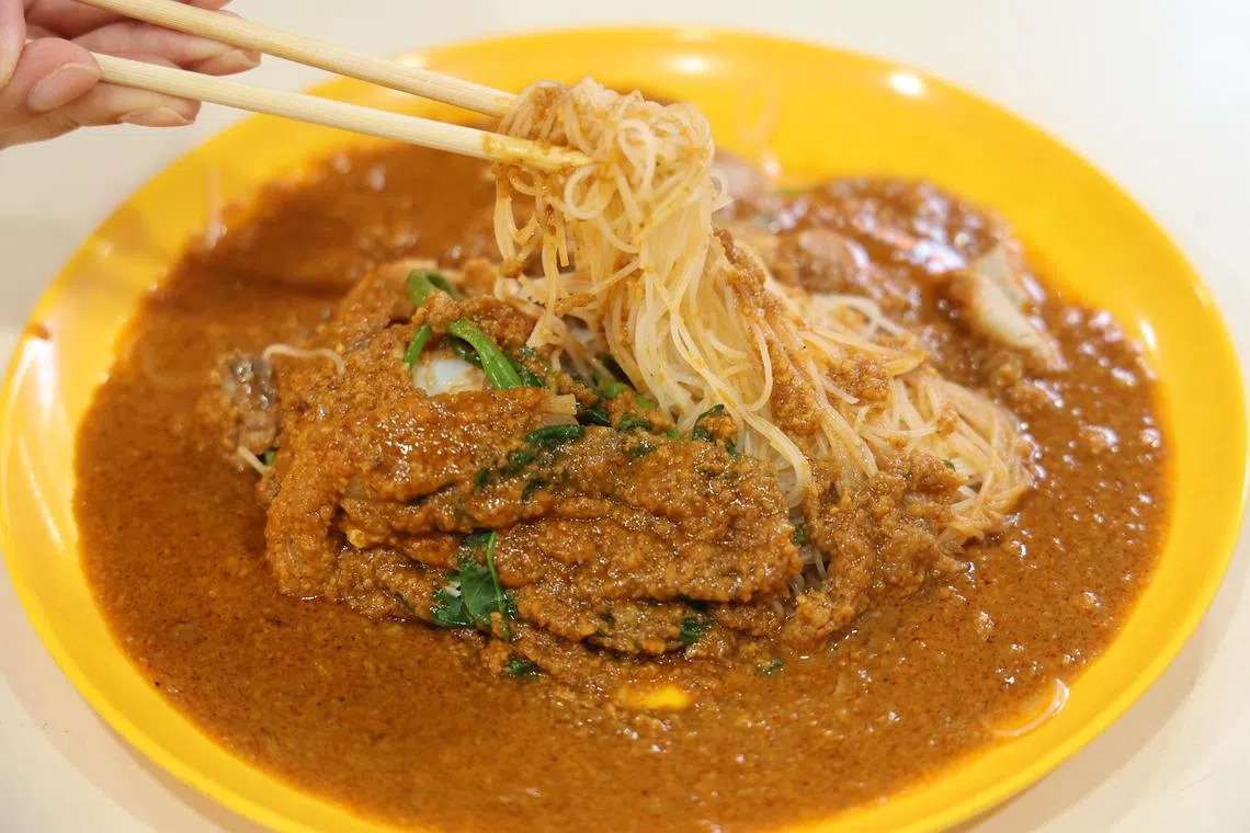 红砂厘沙爹米粉，沙爹酱稠度恰到好处，微辣中还可吃到花生碎。（唐家鸿摄）