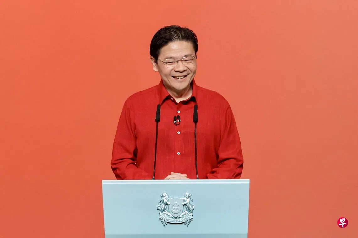 黄循财总理将在星期天（8月23日）傍晚6时45分，先以马来语和华语演讲，随后于晚上8时，以英语发表演说。照片摄于去年的国庆群众大会。 （档案照片）