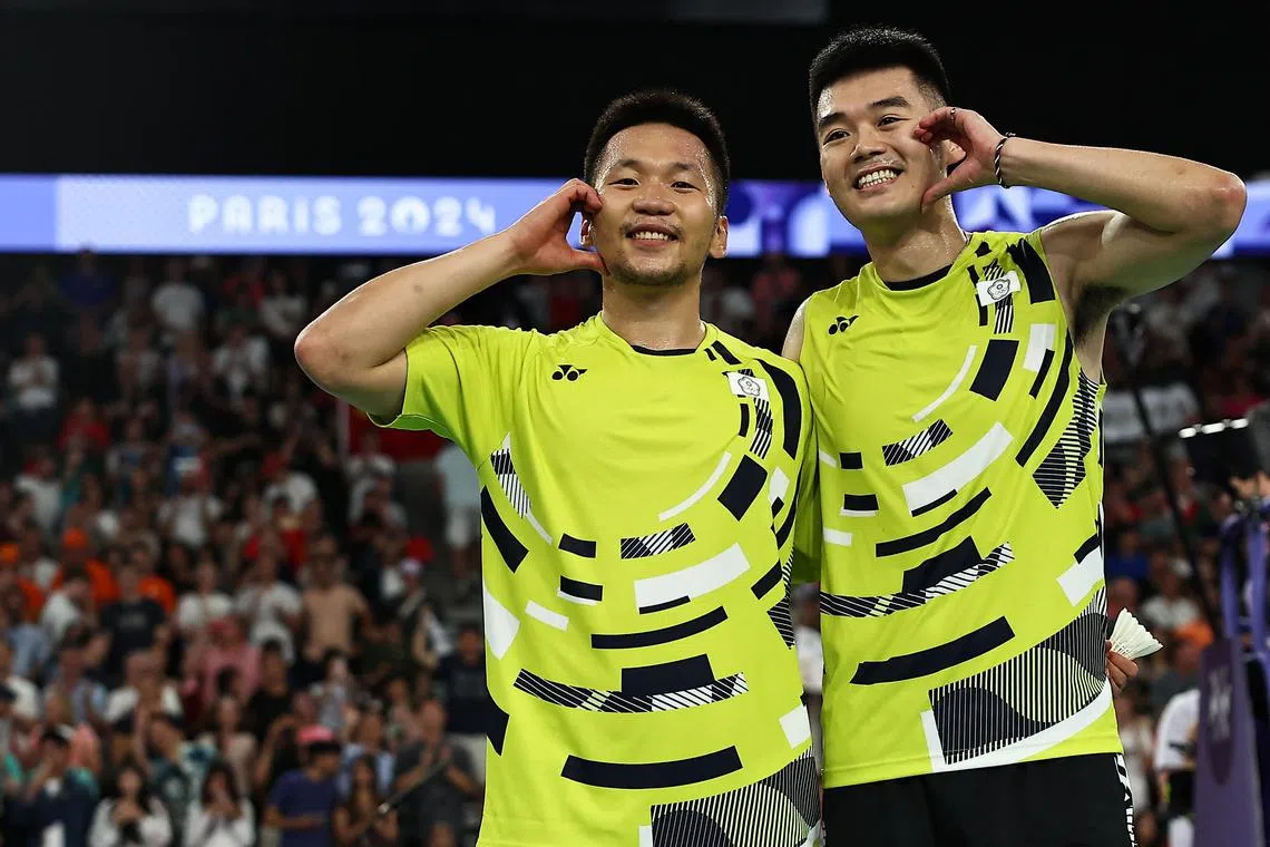中华台北球员李洋（左）和王齐麟，是史上第一支完成奥运羽球男双“二连霸”的组合。（路透社）