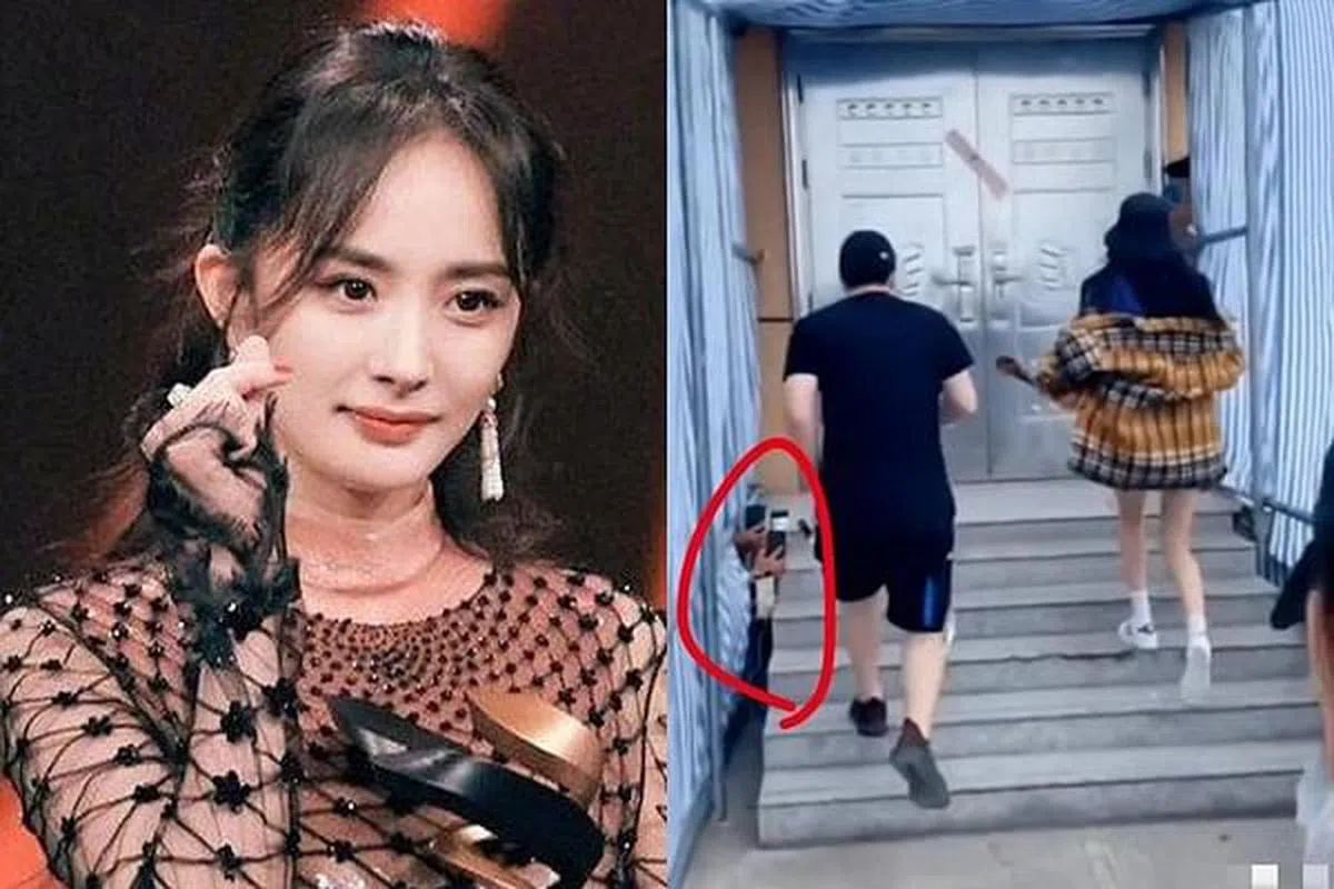 杨幂被代拍（红圈者）恶意蹲下拍摄不雅角度。（互联网）