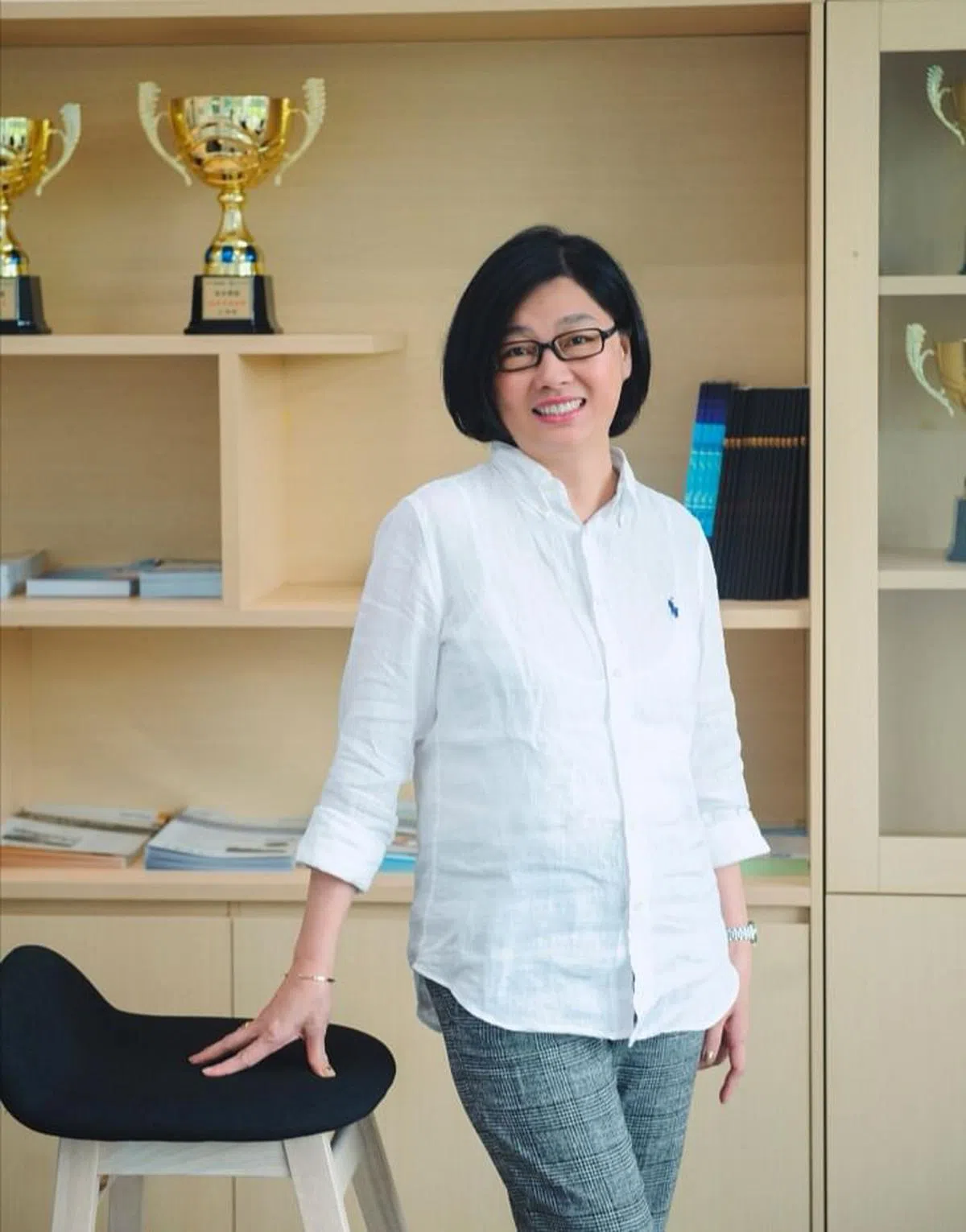 从小就有商业头脑的小瑀和先生共同创办了禹智集团，立志用30年来打造优质水世界。（贺玉荣摄）