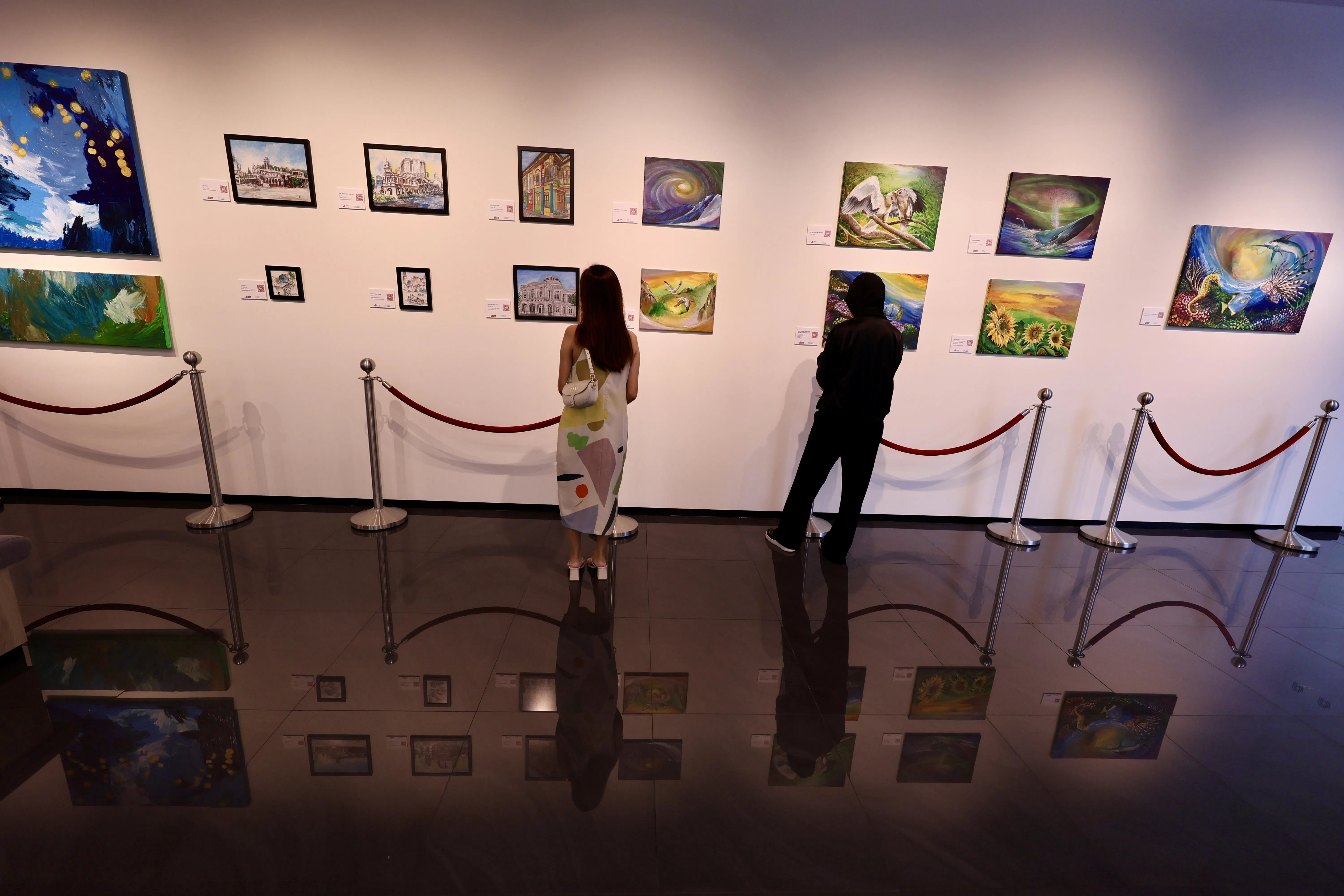 “心动画廊”现展出16幅不同主题的艺术作品，都是由特需艺术者绘制而成。（特约陈来福摄）