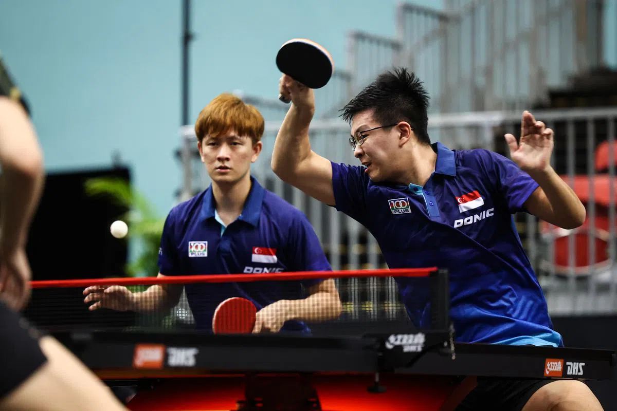 河内东运会上勇夺金牌的男双组合周哲宇（左）、傅绍峰。（李建玮摄）