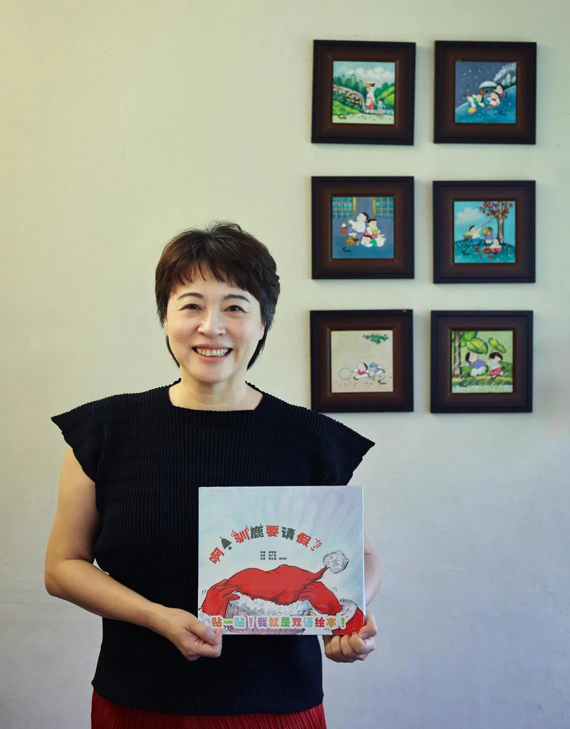 新加坡华文教研中心学前部门主任、高级讲师郑婉妮博士是圣诞主题绘本《啊！驯鹿要请假？》作者。（龙国雄摄）