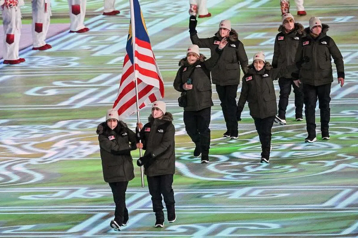 冬奥会开幕式上，马来西亚代表团入场。（法新社）